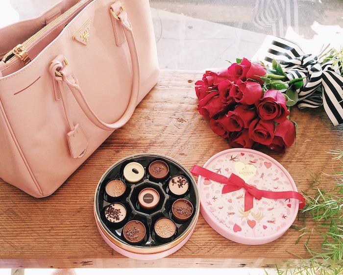 Pink & Red For Valentine's Day, Flowers, GODIVA Chocolate, Teri Jon by Rickie Freeman Pink Dress with Bow, Miu Miu Bow Pumps, Prada Bag, via: HallieDaily