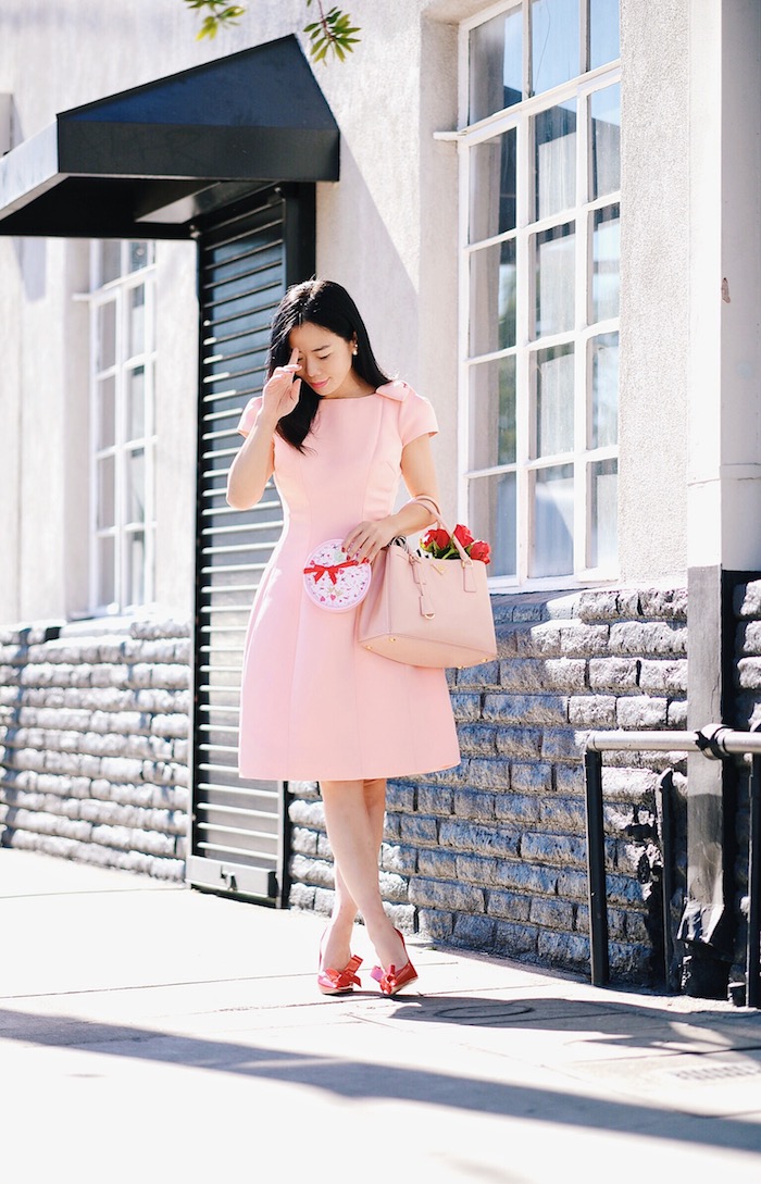 Pink & Red For Valentine's Day, Flowers, GODIVA Chocolate, Teri Jon by Rickie Freeman Pink Dress with Bow, Miu Miu Bow Pumps, Prada Bag, via: HallieDaily