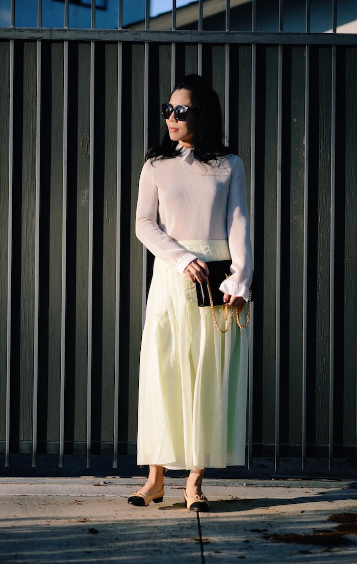 Sunset: Tibi Pleated Skirt, Chanel Two-tone Flats, YSL Bag, via: HallieDaily