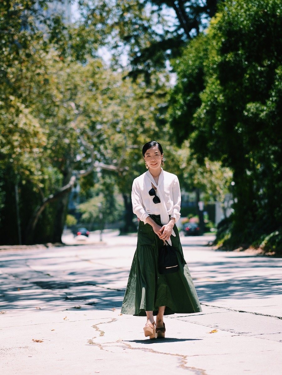 Easy Breathe: Silk Bow Tie Blouse, Marissa Webb Llsa Skirt, Platform Clogs, Mini Bucket Bag, via: HallieDaily