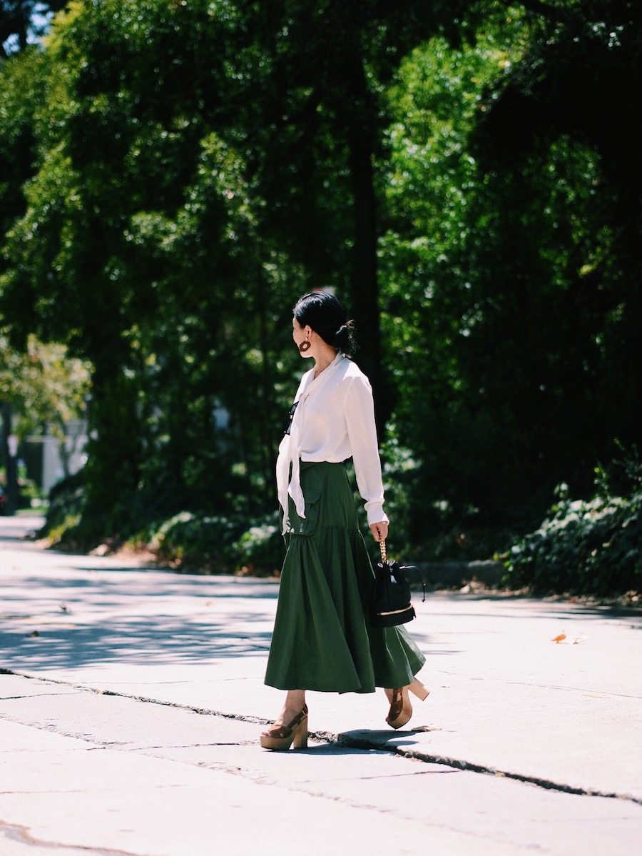 Easy Breathe: Silk Bow Tie Blouse, Marissa Webb Llsa Skirt, Platform Clogs, Mini Bucket Bag, via: HallieDaily