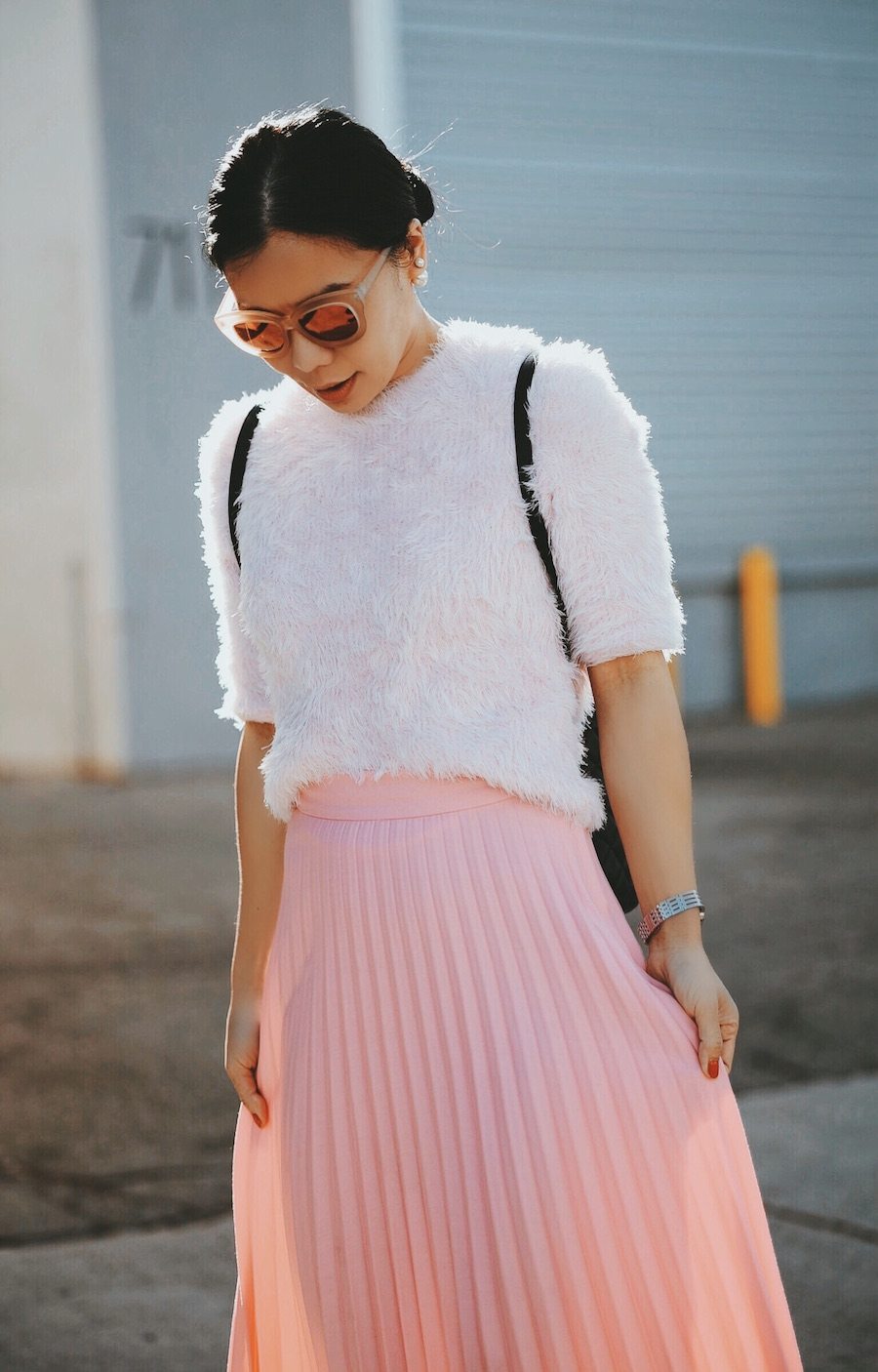 In Pink: Carven Pink Sweater, Pink Pleated Skirt, Chanel Backpack, Ankle Boots, via: HallieDaily